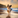 A dog running by the beach making the collar dirty and the owner washes it with ease.