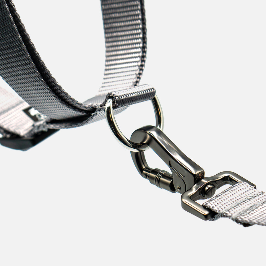 Durable grey step-in harness by Woof Concept, made in Canada, featuring adjustable straps and a no-pull design, ideal for dog collar users.